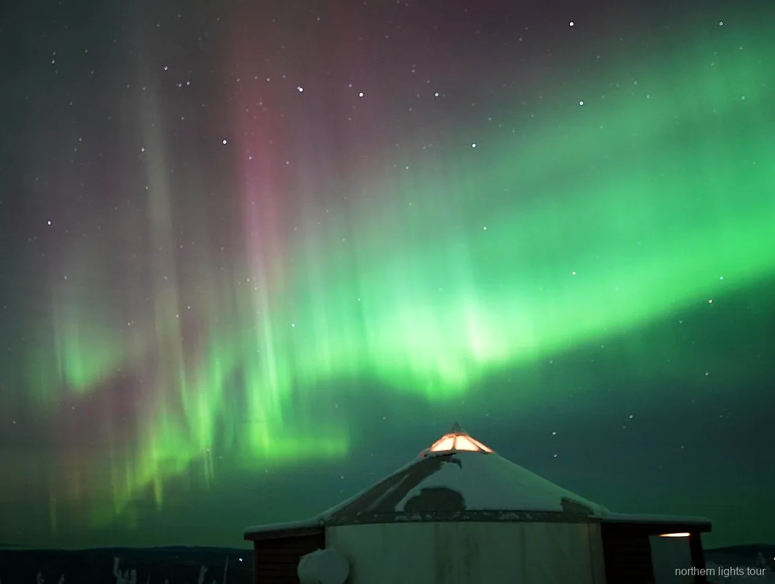 Aurora Borealis viewed through the windows of the Fairbanks aurora lodge tour