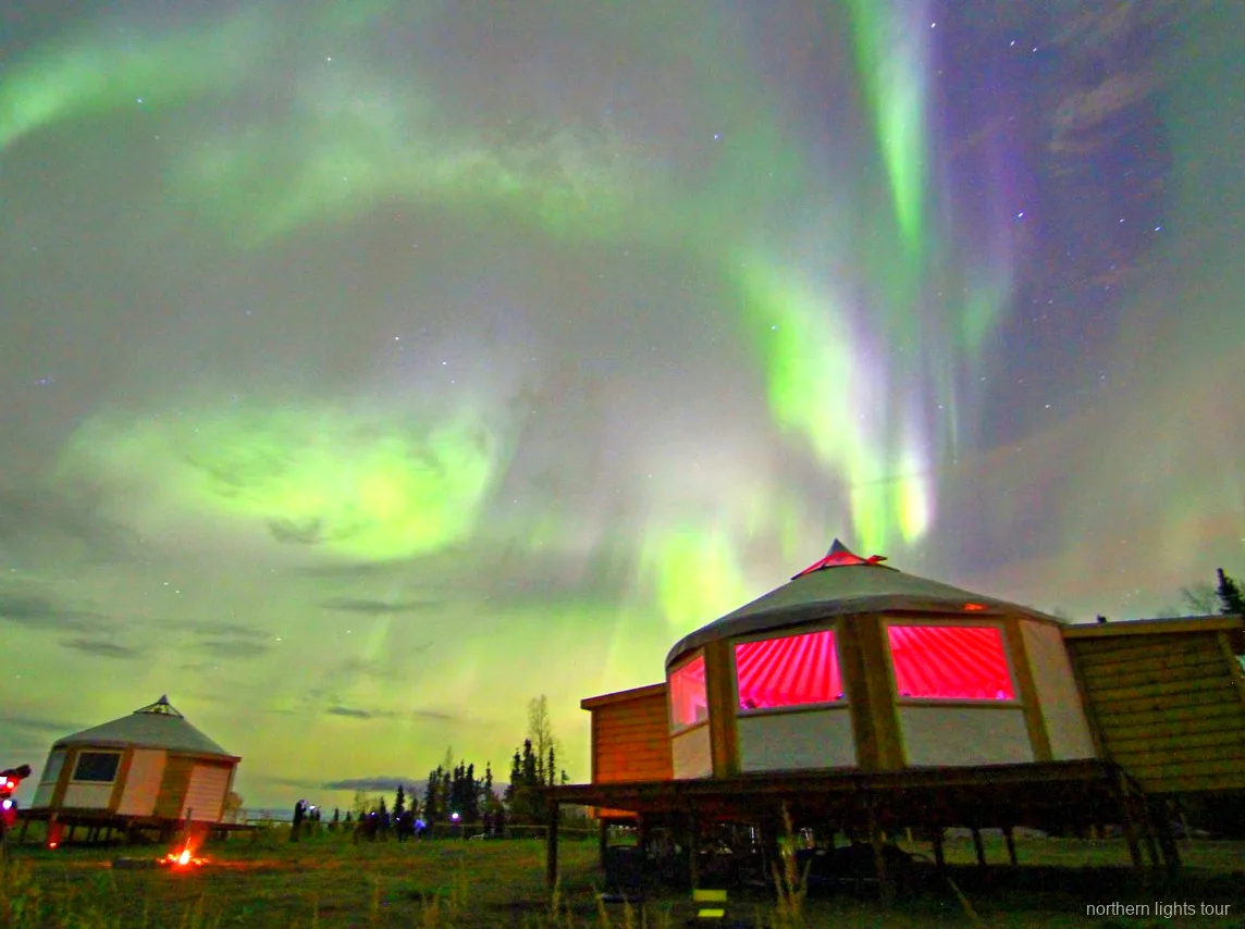 Guests relaxing at the Fairbanks aurora lodge while waiting for the Northern Lights