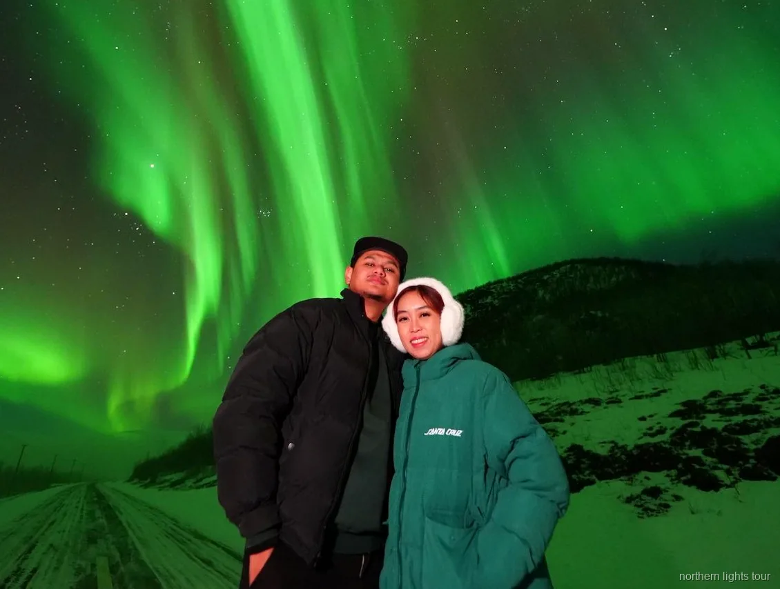 Rovaniemi Northern Lights Guaranteed Tour group photographing the aurora